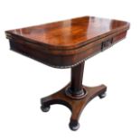 A 19TH CENTURY ROSEWOOD FOLD OVER CARD TABLE Supported on a hexagonal column, raised on squash bun