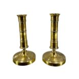 A PAIR OF GEORGIAN BRASS CANDLESTICKS, Height-17cm, Diameter-8.7cm.