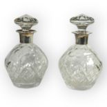 GARRARD & CO. AND J.B. CHATTERLEY & SONS LTD, A NEAR PAIR OF SILVER TOPPED DECANTERS Both hallmarked