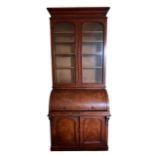 A 19TH CENTURY VICTORIAN MAHOGANY BUREAU BOOKCASE With glazed doors opening to reveal shelf interior