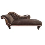 A 19TH CENTURY VICTORIAN CARVED WALNUT DAYBED Scrolling back and arm, raised on turned legs. (h 90cm