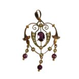 AN EDWARDIAN 9CT GOLD, AMETHYST AND SEED PEARL PENDANT In the shape of a stylised heart with