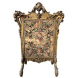 MANNER OF WILLIAM KENT, A 19TH CENTURY CARVED GILTWOOD EMBROIDERED PANEL FIRE SCREEN The top wi