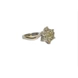 AN 18CT WHITE GOLD FLORAL STYLE DIAMOND RING flanked with diamond shoulders, with WGI