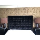 A BLACK VELVET BUTTON UPHOLSTERED DOUBLE BEDSTEAD. (w 195cm x h 166cm) Condition: good, some light