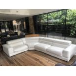 ROCHEBOBOIS, A THREE PIECE CORNER SETTEE With adjustable headrests in cream leather upholstery,