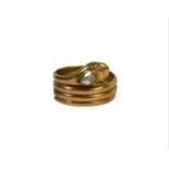 A VICTORIAN 15CT GOLD AND DIAMOND SNAKE COILED RING Having pear shaped rose cut diamond (approx. 6mm