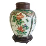 A 19TH CENTURY CHINESE FAMILLE VERTE PORCELAIN GINGER JAR Having four arch form cartouche