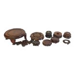 A COLLECTION OF TEN 19TH CENTURY JAPANESE WOODEN STANDS To include a lotus form with Ying Yang