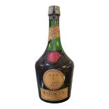 BENEDICTINE, A VINTAGE BOTTLE OF D.O.M LIQUEUR Red seal top with red wax seal to body. (approx 25cm)
