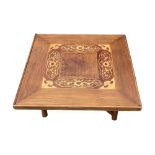 AN EARLY 20TH CENTURY ASIAN ELM AND MARQUETRY INLAID TEA TABLE With square top on folding stand. (