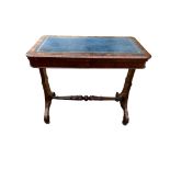 A VICTORIAN FAUX WALNUT FOLD OVER WRITING GAMES TABLE With blue tooled leather surface enclosing a