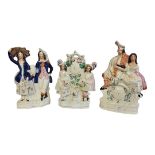 STAFFORDSHIRE, A 19TH CENTURY FLATBACK POTTERY FIGURAL GROUP OF SCOTTISH PIPE PLAYER AND HIS