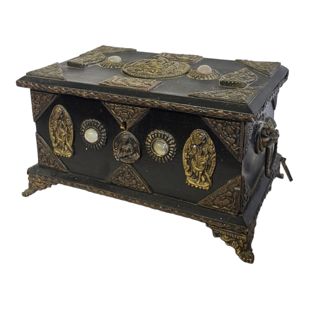 A 1920’S SINO-TIBETAN EBONISED JEWELLERY CASKET/BOX AND COVER Applied with metal mounted panels of
