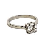 AN 18CT WHITE GOLD AND DIAMOND SOLITAIRE Having a single round cut diamond in a plain setting. (size