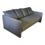 A CONTEMPORARY THREE SEAT SETTEE AND ARMCHAIR In grey fabric upholstery with loose cushions. (