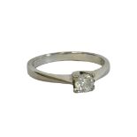 AN 18CT WHITE GOLD AND 1/4CT SOLITAIRE DIAMOND RING Set with a round cut diamond in plain 18ct white