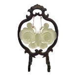 A CHINESE CELADON GLAZED JADE PENDANT MODELLED AS A BUTTERFLY With lustre iridescent glazes,