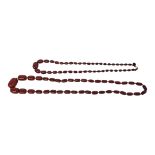 TWO VICTORIAN CHERRY AMBER NECKLACE Having a single strand oval graduated oval beads. (longest
