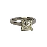 A PLATINUM AND 3.07CT SOLITAIRE DIAMOND RING The single Princess cut diamond in plain white gold