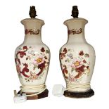A PAIR OF MASON'S IRONSTONE OCTAGONAL POTTERY LAMPS Decorated with autumnal flowers on wooden