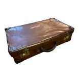A VINTAGE STITCHED TAN LEATHER SUITCASE With brass locks. (60cm x 38cm x 16cm) Condition: good