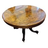 A HIGH VICTORIAN BURR WALNUT AND FLORAL TUNBRIDGE INLAID OVAL LOO TABLE With tilt top action, raised