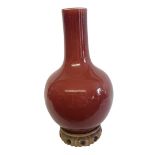 A 20TH CENTURY CHINESE FLAMBE GLAZED BOTTLE FORM VASE Applied to hard paste porcelain body with