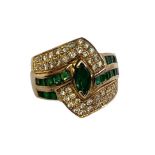 A VINTAGE YELLOW METAL, EMERALD AND DIAMOND DRESS RING The central marquise cut stone flanked by two