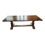 AN 18TH CENTURY DESIGN SOLID OAK REFECTORY TABLE The four plank top with breadboard ends raised on