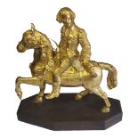 AN EARLY 20TH CENTURY GILDED BRONZE FIGURE OF AN 18TH CENTURY MILITARY OFFICER IN FULL REGALIA ON