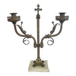 AFTER PUGIN, A VICTORIAN GOTHIC REVIVAL SOLID GILDED BRASS TWO BRANCH ALTAR CANDELABRA, CIRCA 1880