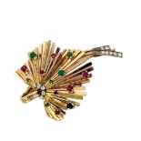 A FRENCH 18CT GOLD, DIAMOND, RUBY AND EMERALD BROOCH Having a cluster of round cut stones in a