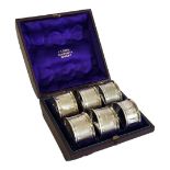 A MATCHED SET OF SIX VICTORIAN SILVER SERVIETTE RINGS To include five hallmarked London, 1873, in