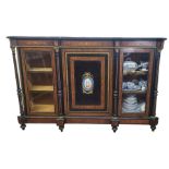 A VICTORIAN WALNUT EBONISED AND MARQUETRY INLAID SIDE CABINET The central panelled door centred with