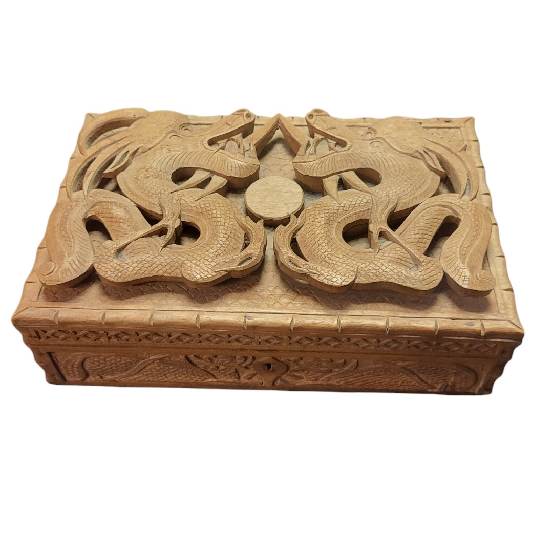 AN EARLY 20TH CENTURY CHINESE WOOD RECTANGULAR DOUBLE DRAGON AND PEARL OF WISDOM BOX AND COVER,