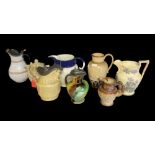 A SELECTION OF EIGHT VARIOUS VICTORIAN PERIOD STONEWARE JUGS Some with pewter covers/lids,