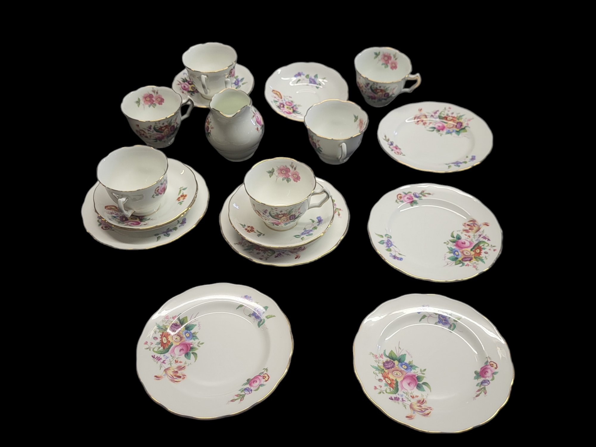 COALPORT, A VINTAGE 'JUNE TIME' PORCELAIN TEA SET Comprising six cups, six saucers, six side