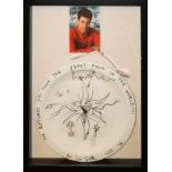 URI GELLER, AN AUTOGRAPHED PORCELAIN PLATE,PHOTOGRAPH AND SPOON The hand decorated plate