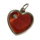 A RUSSIAN SILVER, ENAMEL AND DIAMOND HEART FORM PENDANT The single round cut diamond set in red