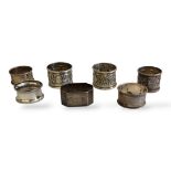 A COLLECTION OF SILVER AND CONTINENTAL SILVER SERVIETTE RINGS Comprising three Indian silver with