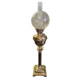 A FINE VICTORIAN GILDED BRASS OIL LAMP OF CORINTHIAN COLUMN WITH CAPITALS, CIRCA 1870 With gilded