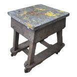 AN EARLY 20TH CENTURY INDUSTRIAL WORK TABLE With steel clad top on pine base, on castors. (62cm x