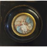 A 19TH CENTURY CIRCULAR MINIATURE PAINTING ON IVORY, BEDROOM SCENE WITH COURTING COUPLE In an