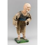 AN EARLY 20TH CENTURY CHINESE FISHERMAN FIGURE. A hand-crafted tourist figure of an old Chinese