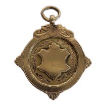 AN EARLY 20TH CENTURY 9CT GOLD POCKET WATCH FOB Shield form, hallmarked Birmingham, 1916. (approx