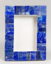 A LAPIS LAZULI PICTURE FRAME ON WHITE MARBLE (h 21cm x w 16cm x d 5.5cm)