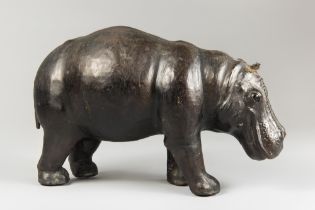 A MID 20TH CENTURY LIBERTY OF LONDON STYLE LEATHER CLAD HIPPOPOTAMUS. With inset glass eyes. (h 29cm