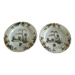 A PAIR OF 18TH CENTURY ENGLISH DELFTWARE TIN GLAZED EARTHENWARE POLYCHROME PAINTED PLATES