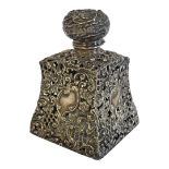 A VICTORIAN SILVER SCENT BOTTLE COVER Tapering square form with pierced and scrolled decoration. (